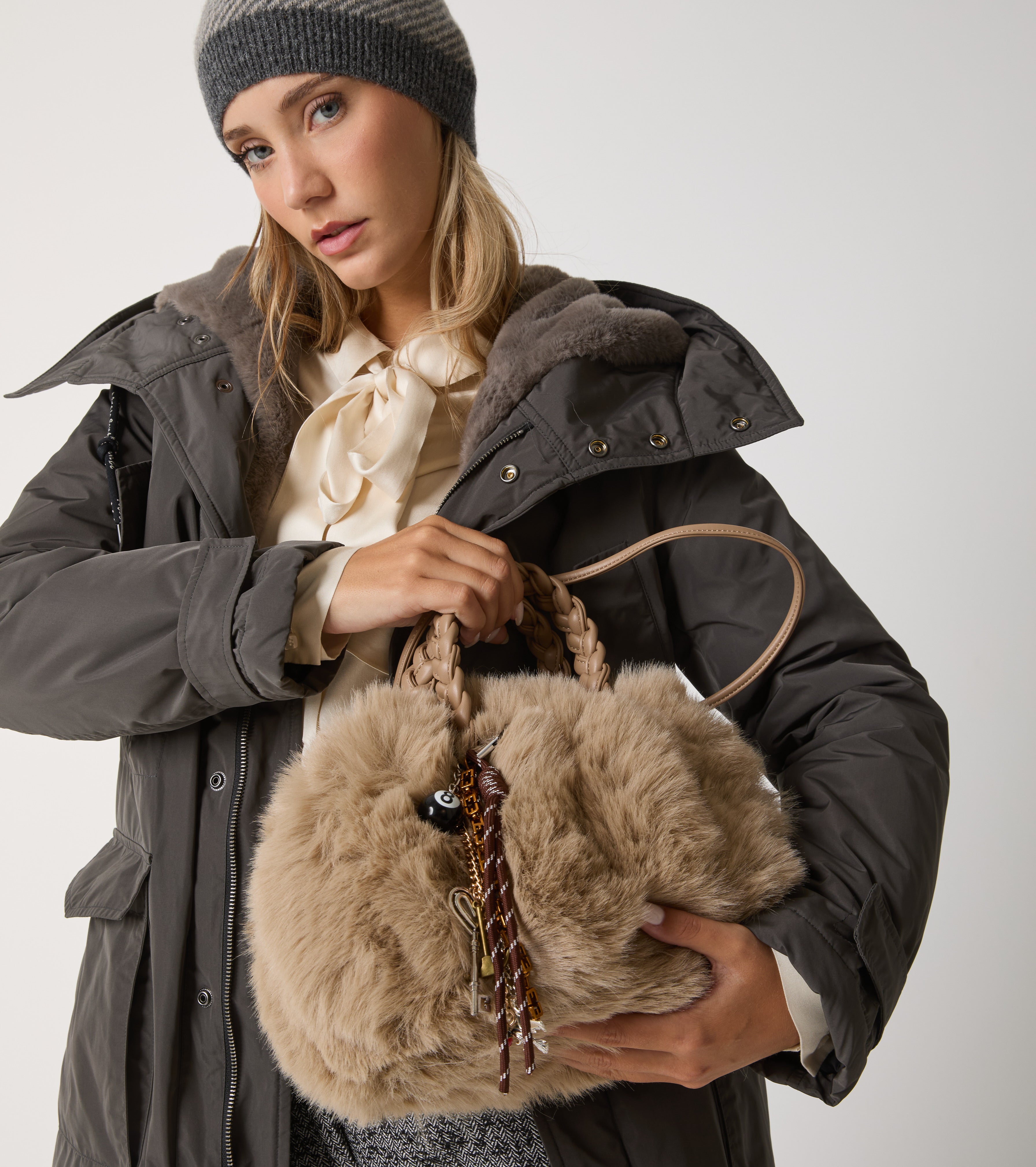 Faux fur bag with woven handles