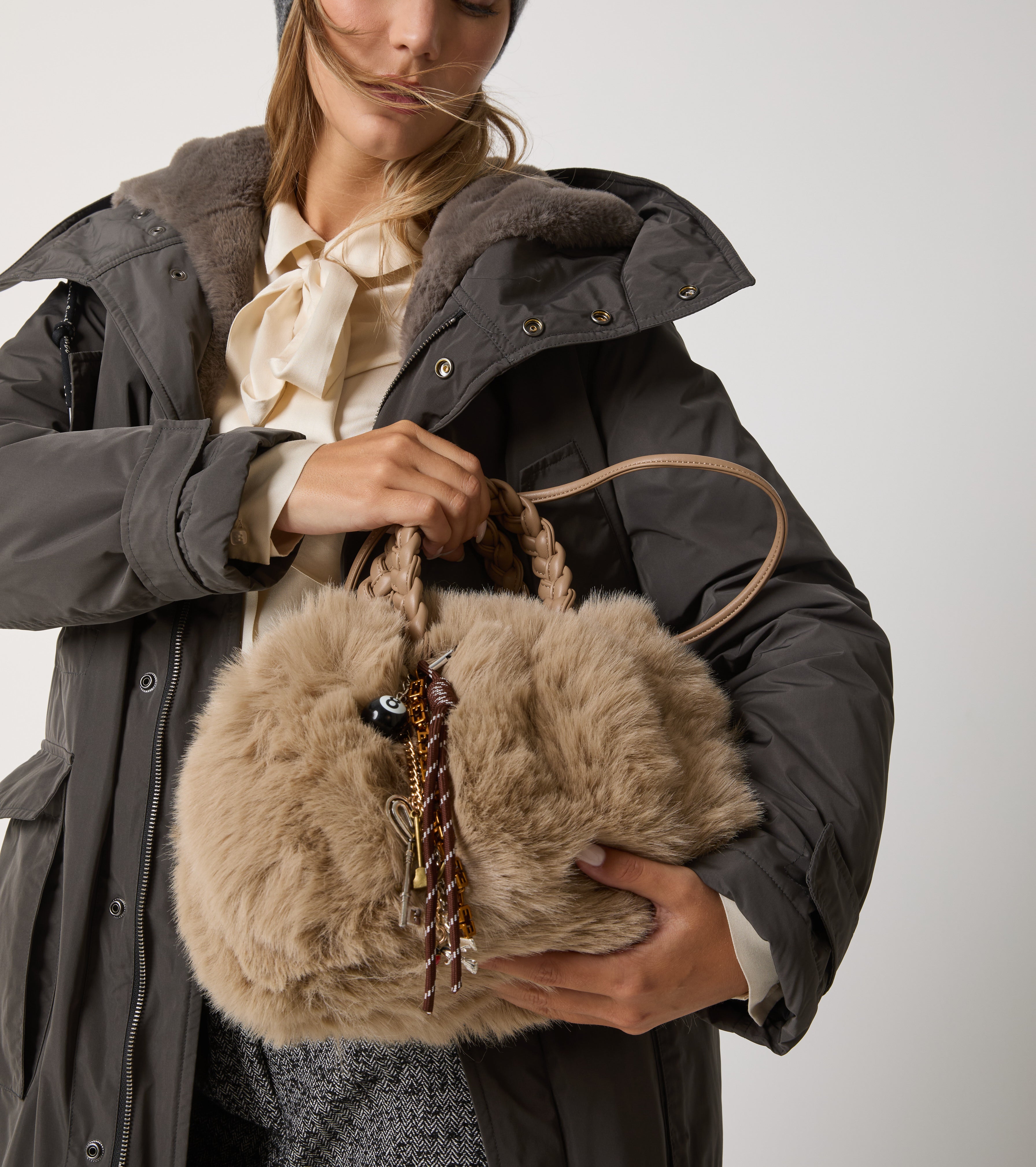 Faux fur bag with woven handles