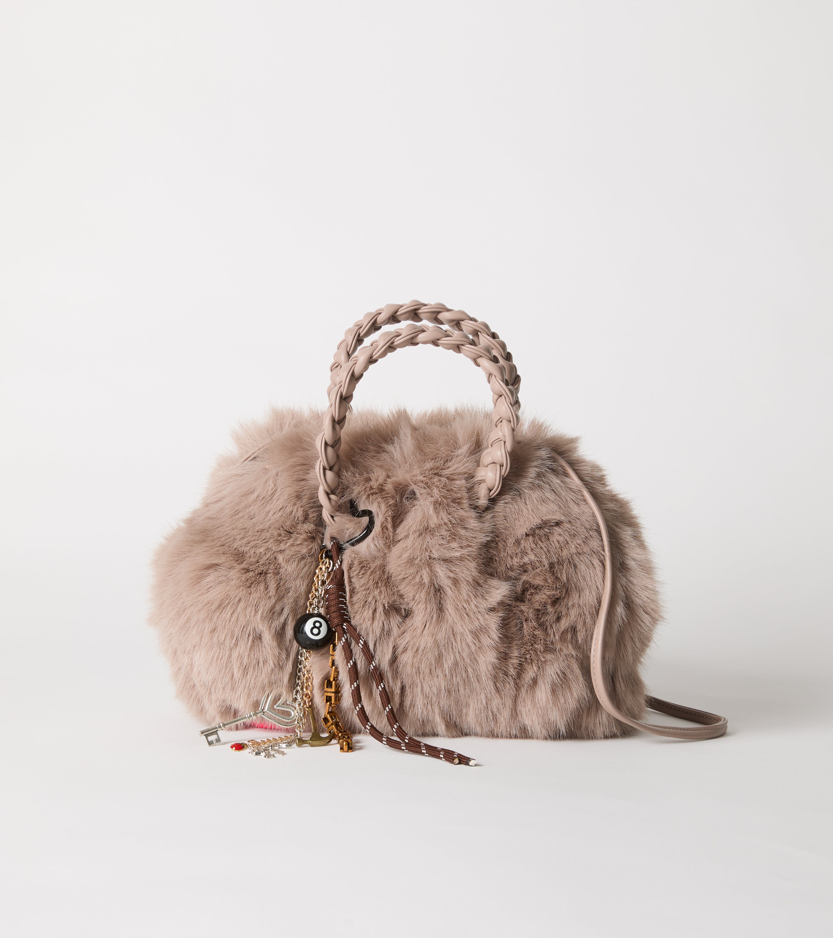 Faux fur bag with woven handles