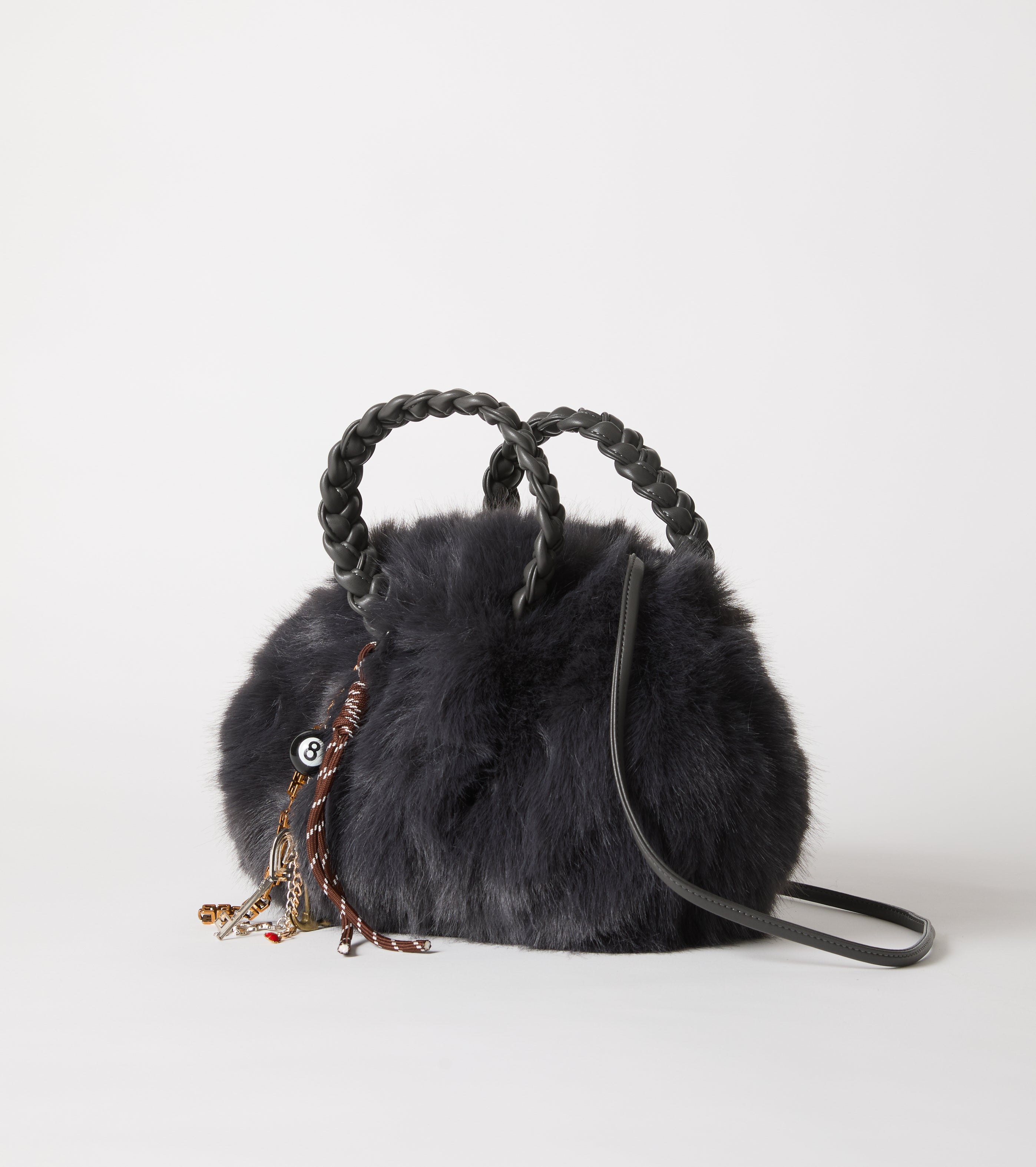 Faux fur bag with woven handles
