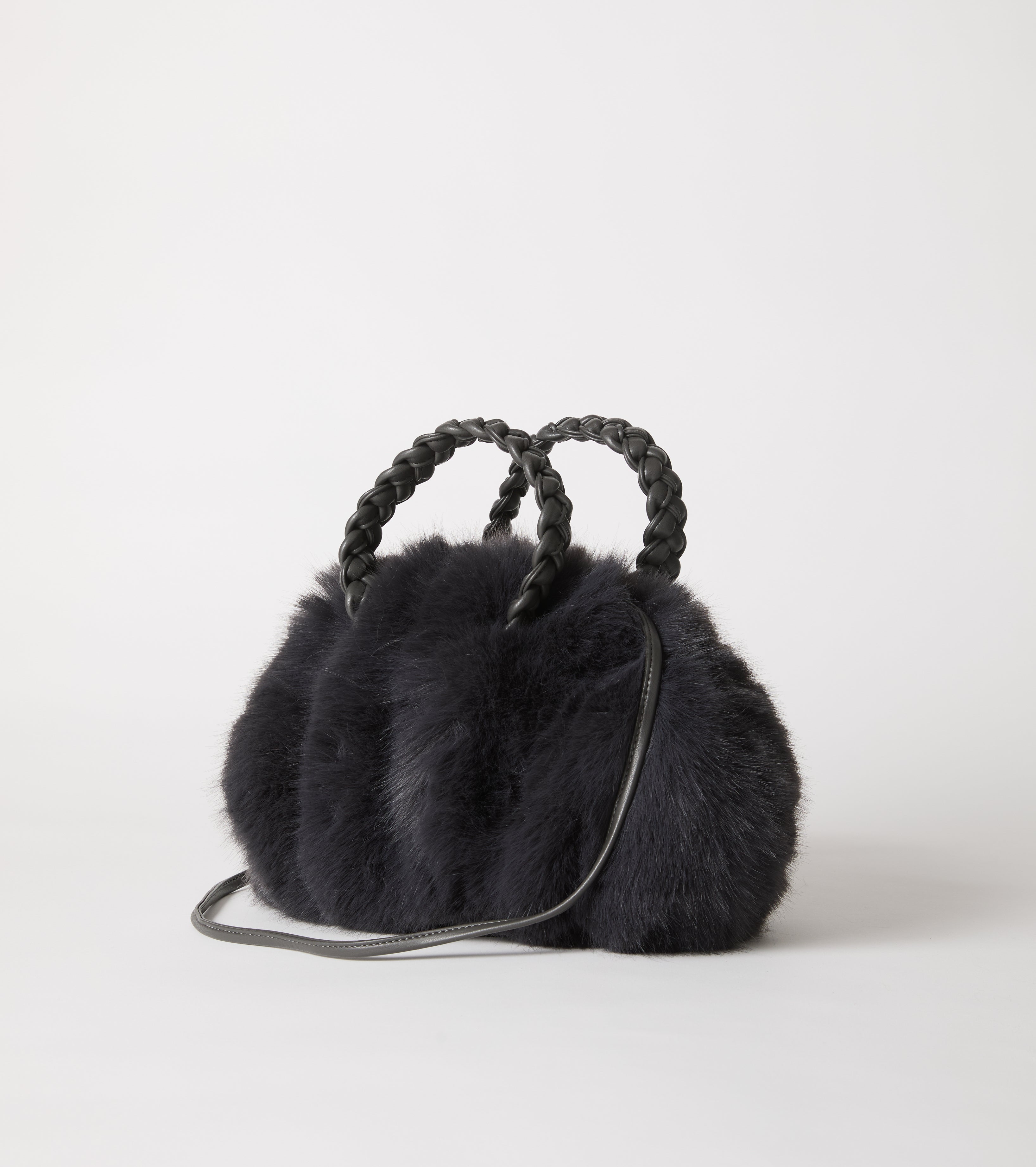 Faux fur bag with woven handles
