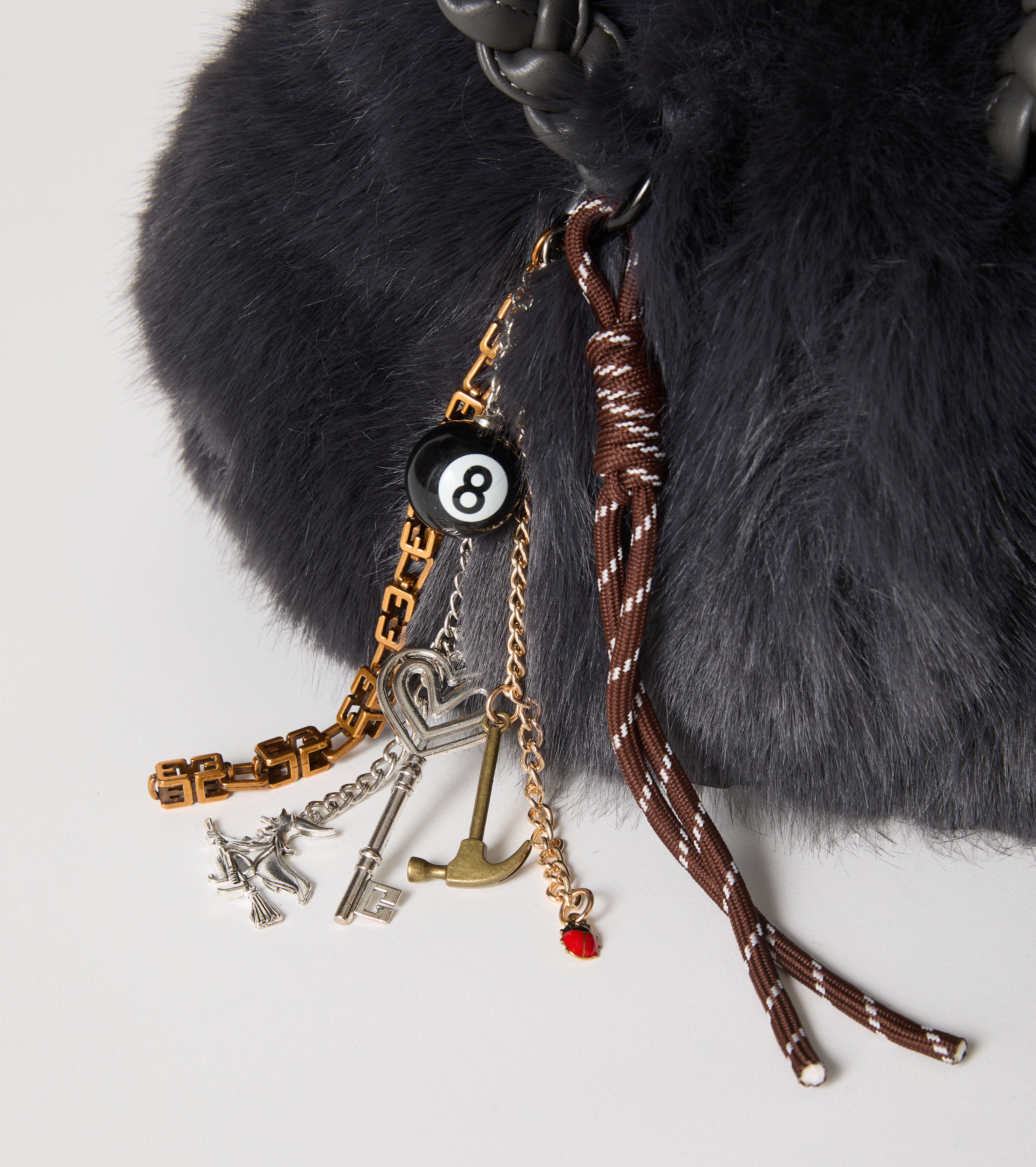 Faux fur bag with woven handles