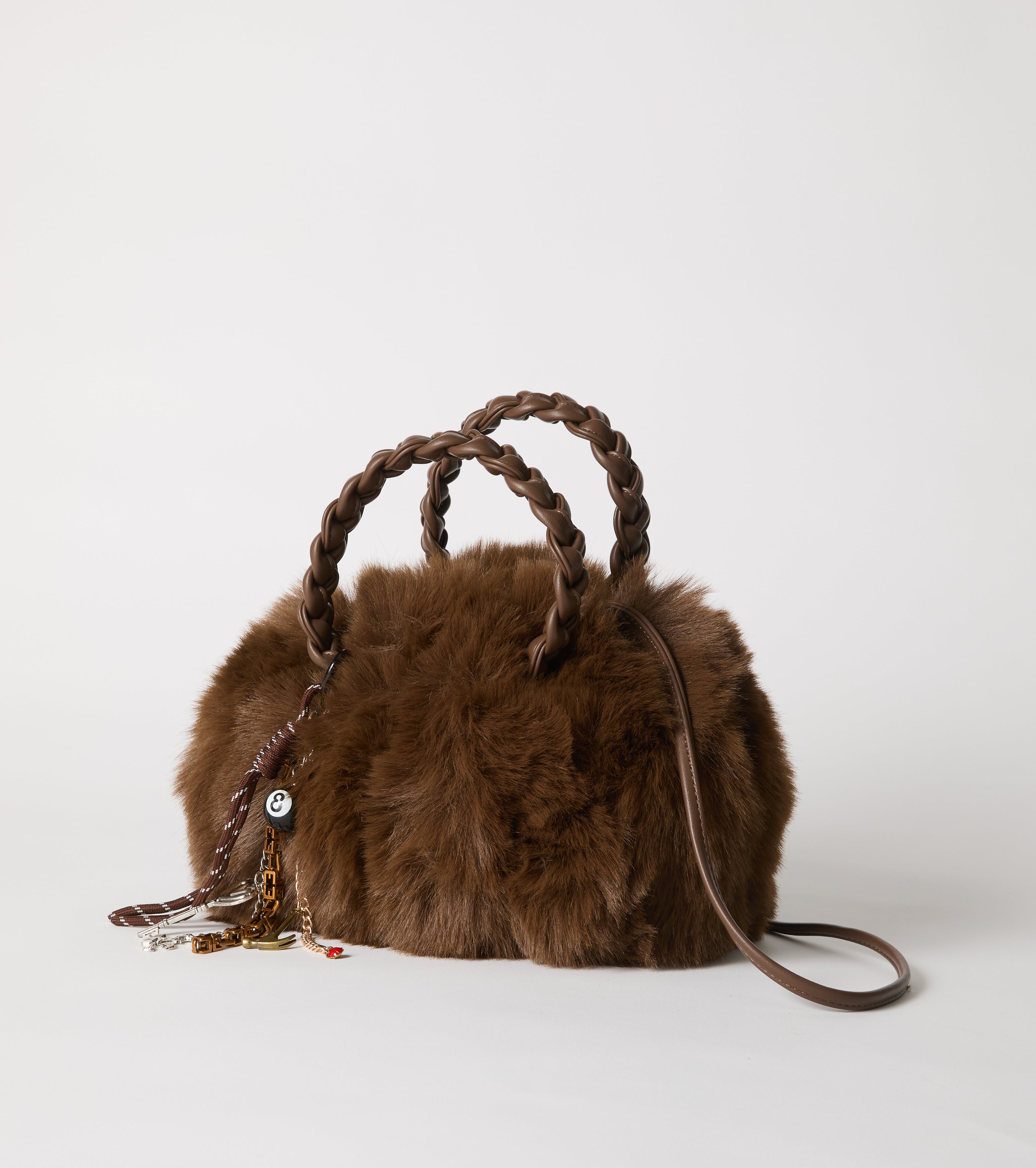 Faux fur bag with woven handles