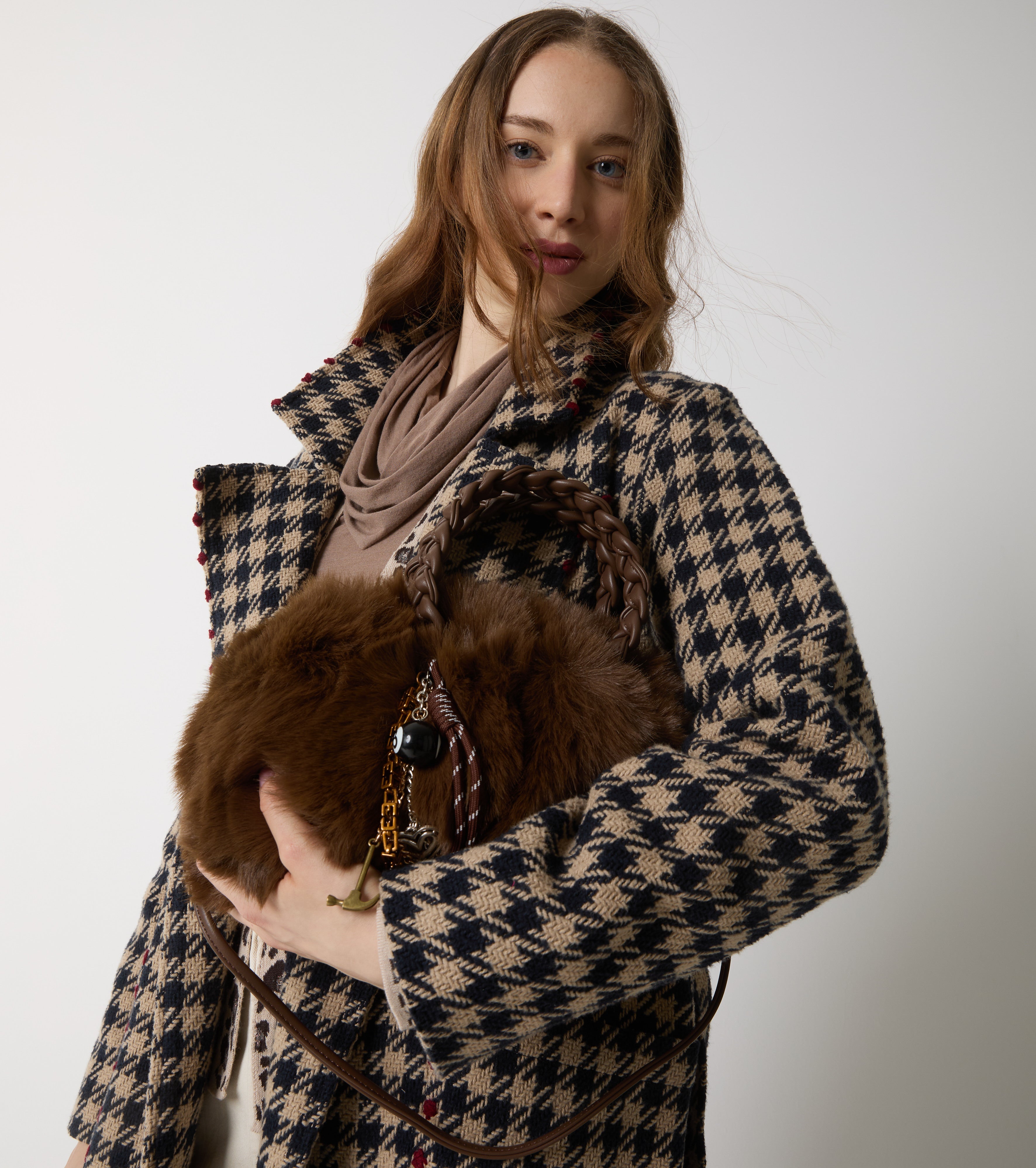 Faux fur bag with woven handles