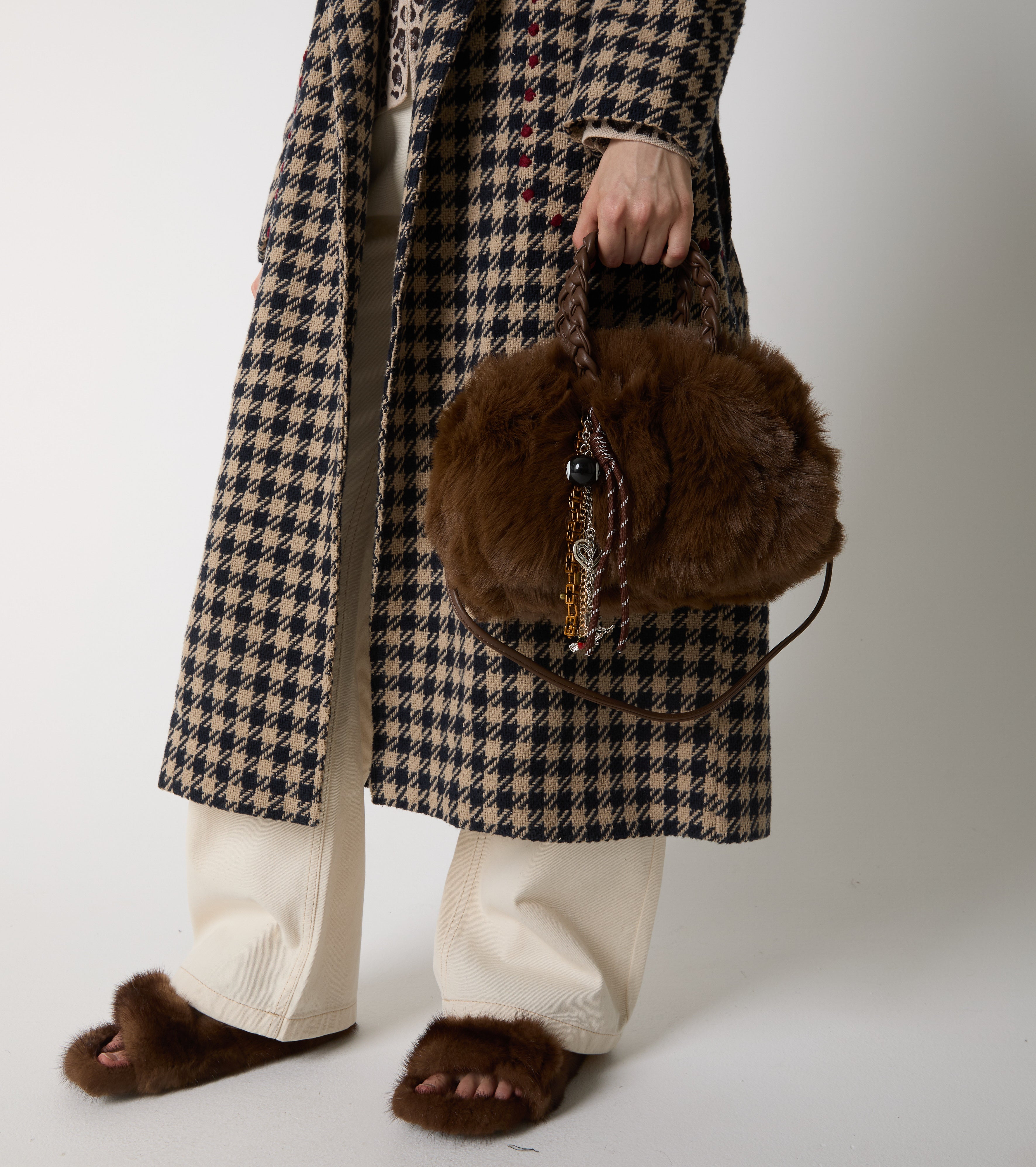 Faux fur bag with woven handles