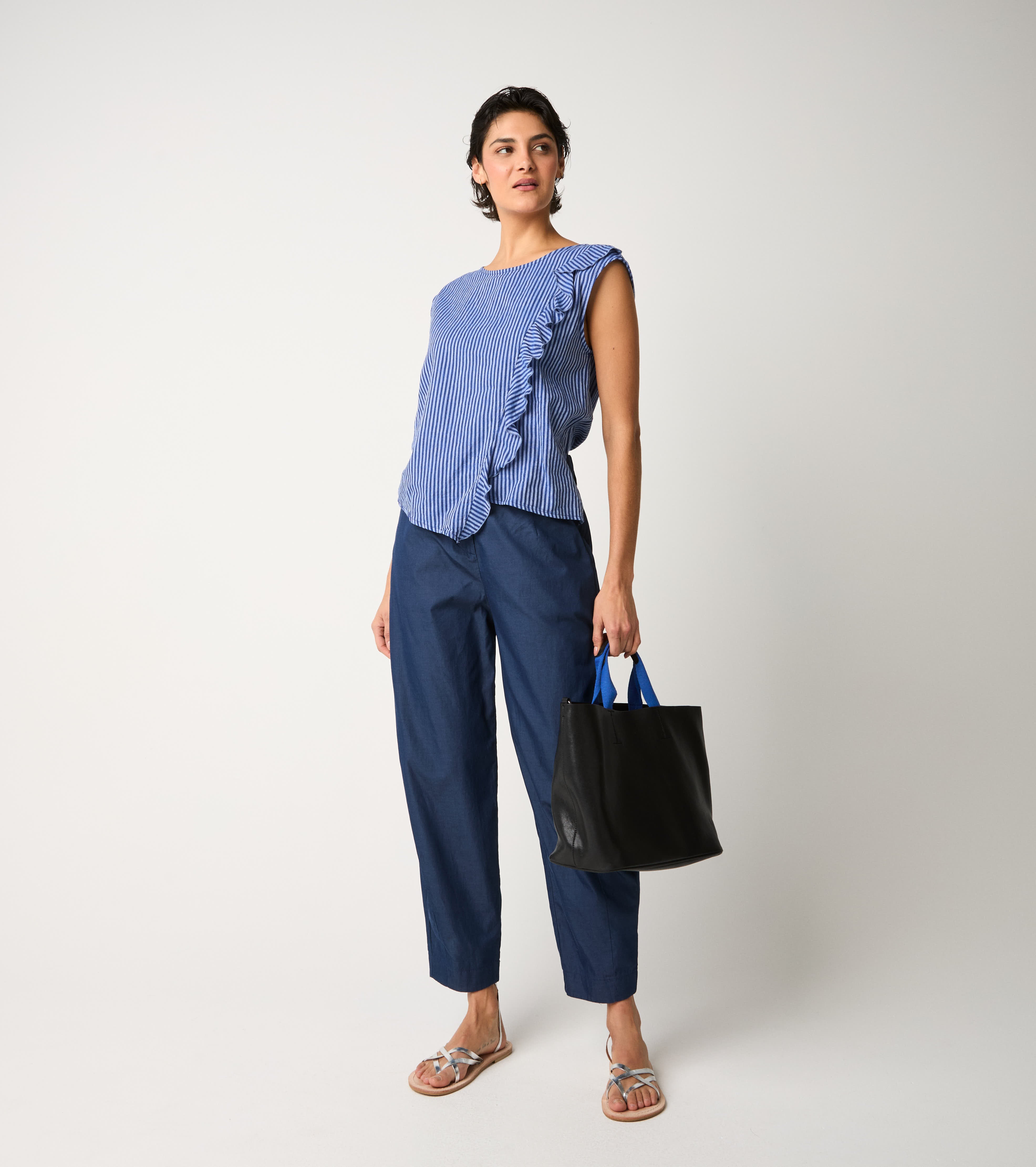 Striped jumpsuit with light blue ruffles