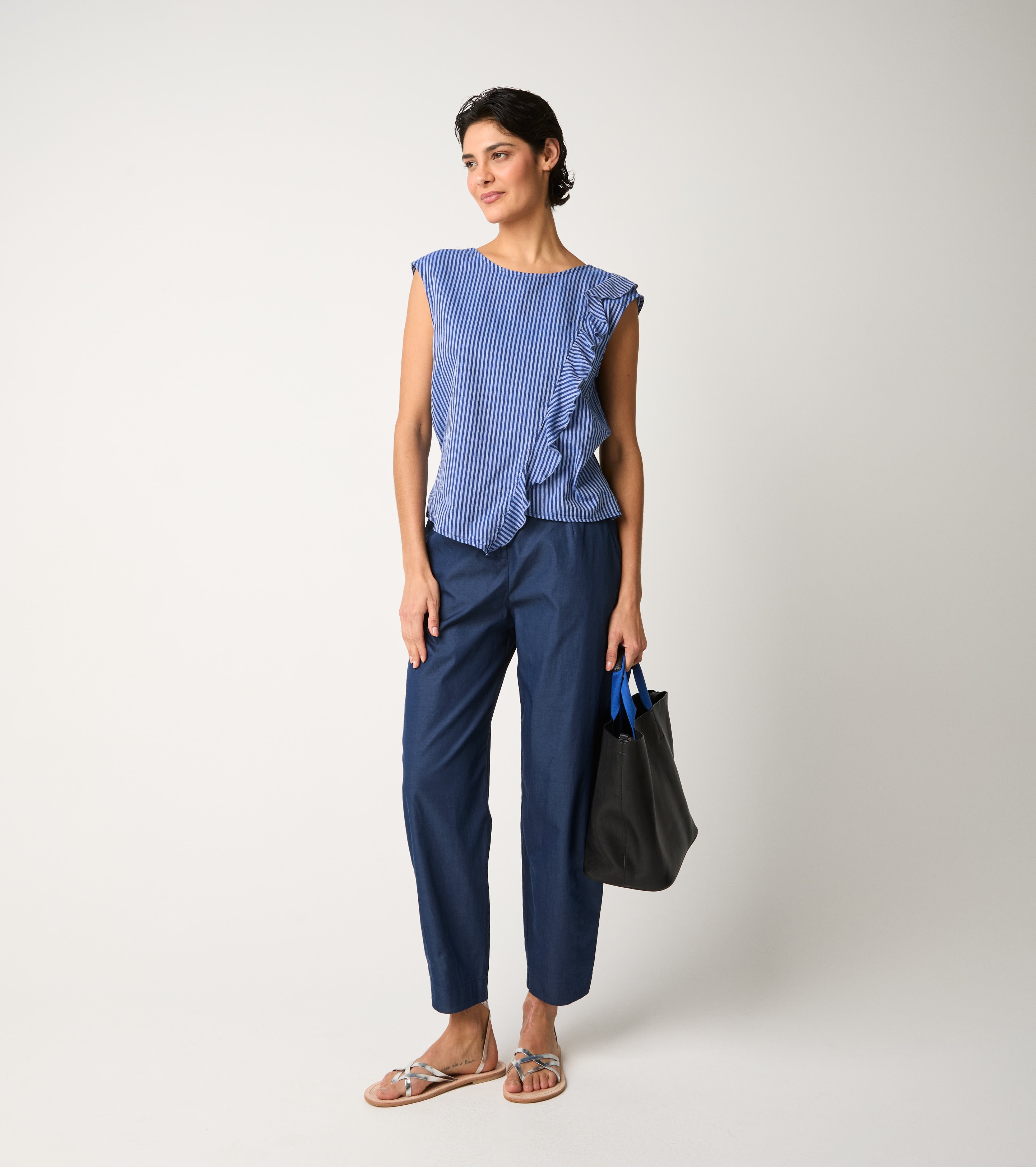 Striped jumpsuit with light blue ruffles