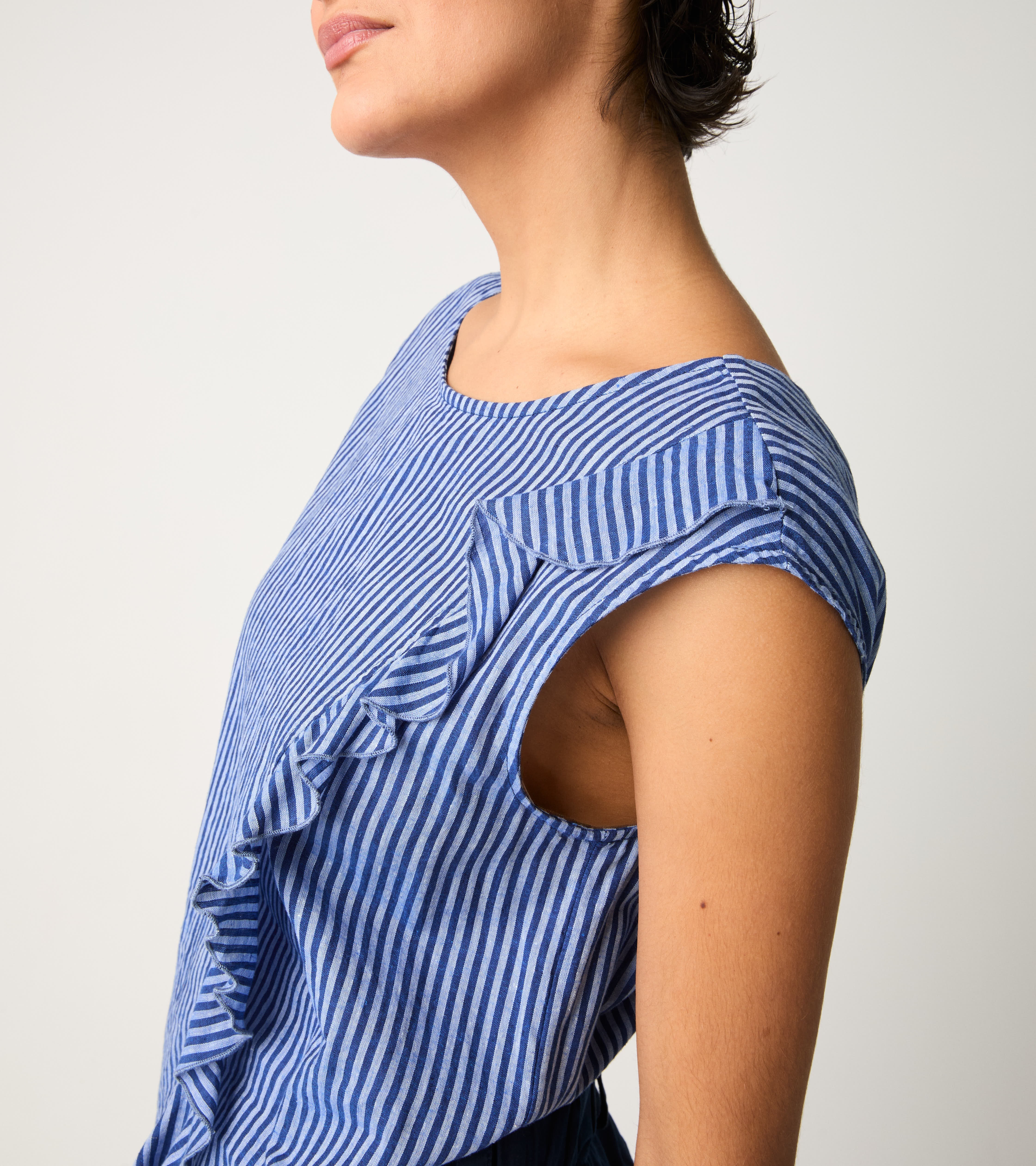 Striped jumpsuit with light blue ruffles