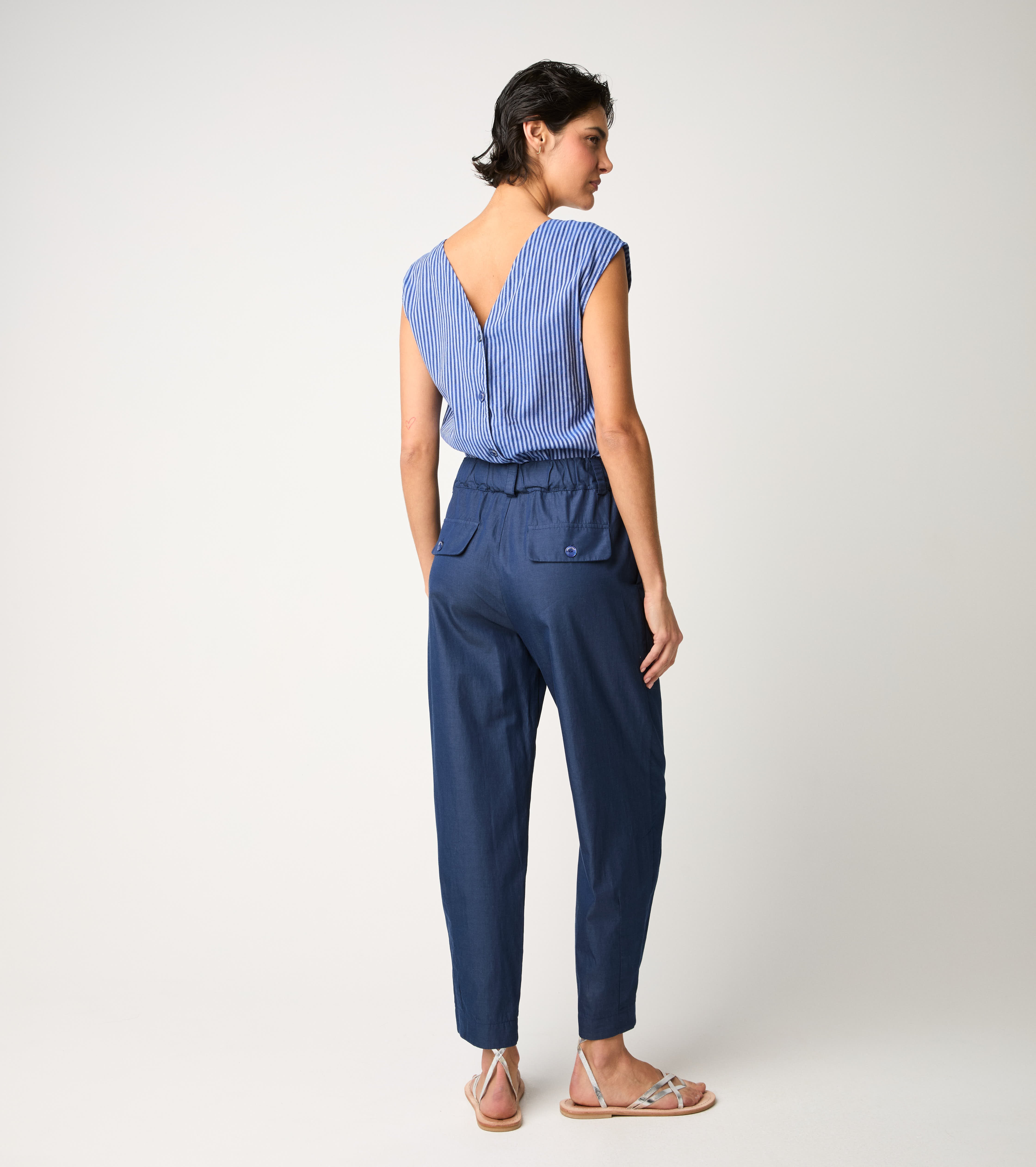 Striped jumpsuit with light blue ruffles
