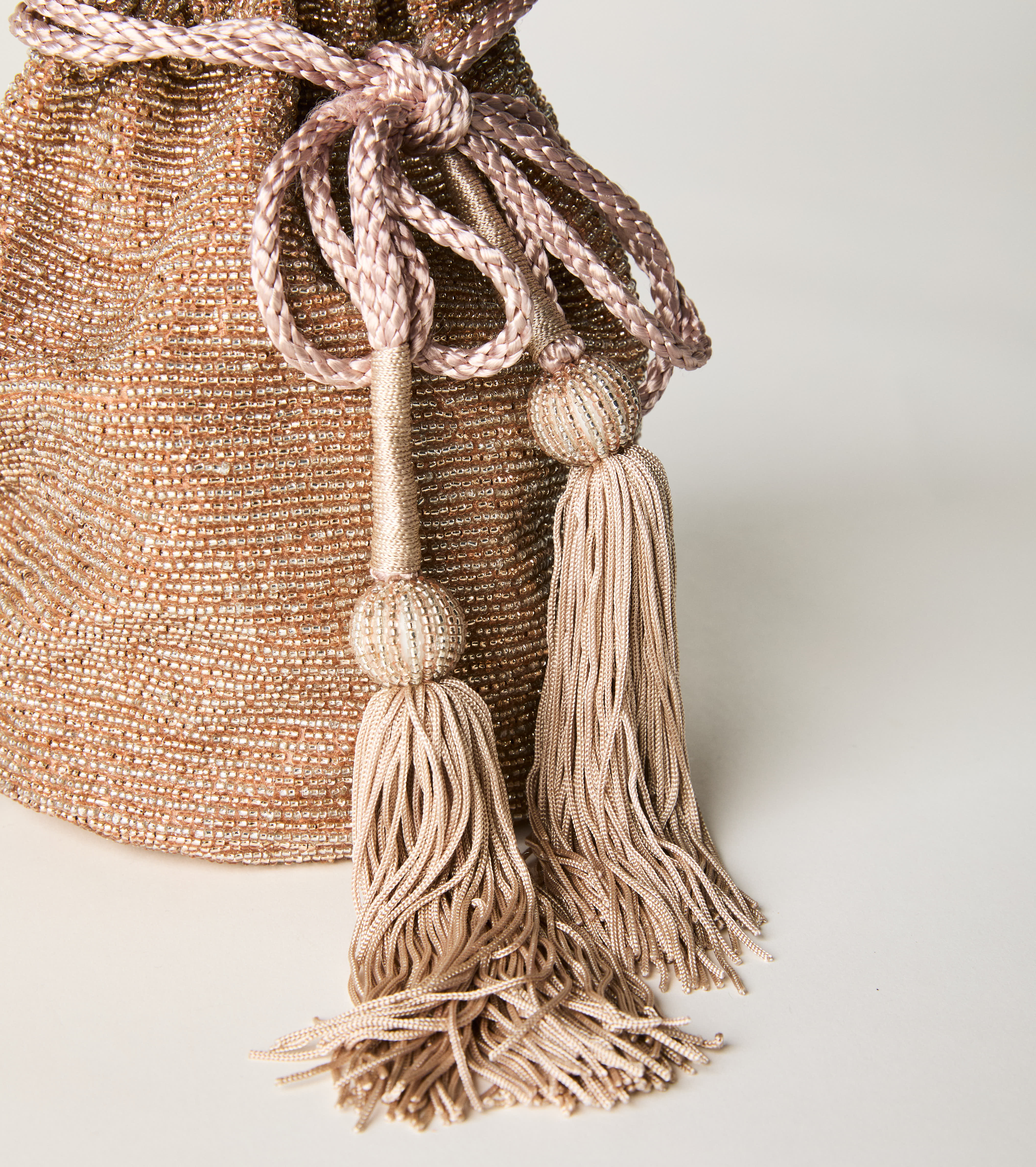 Borsa a secchiello con coulisse e nappine rosa