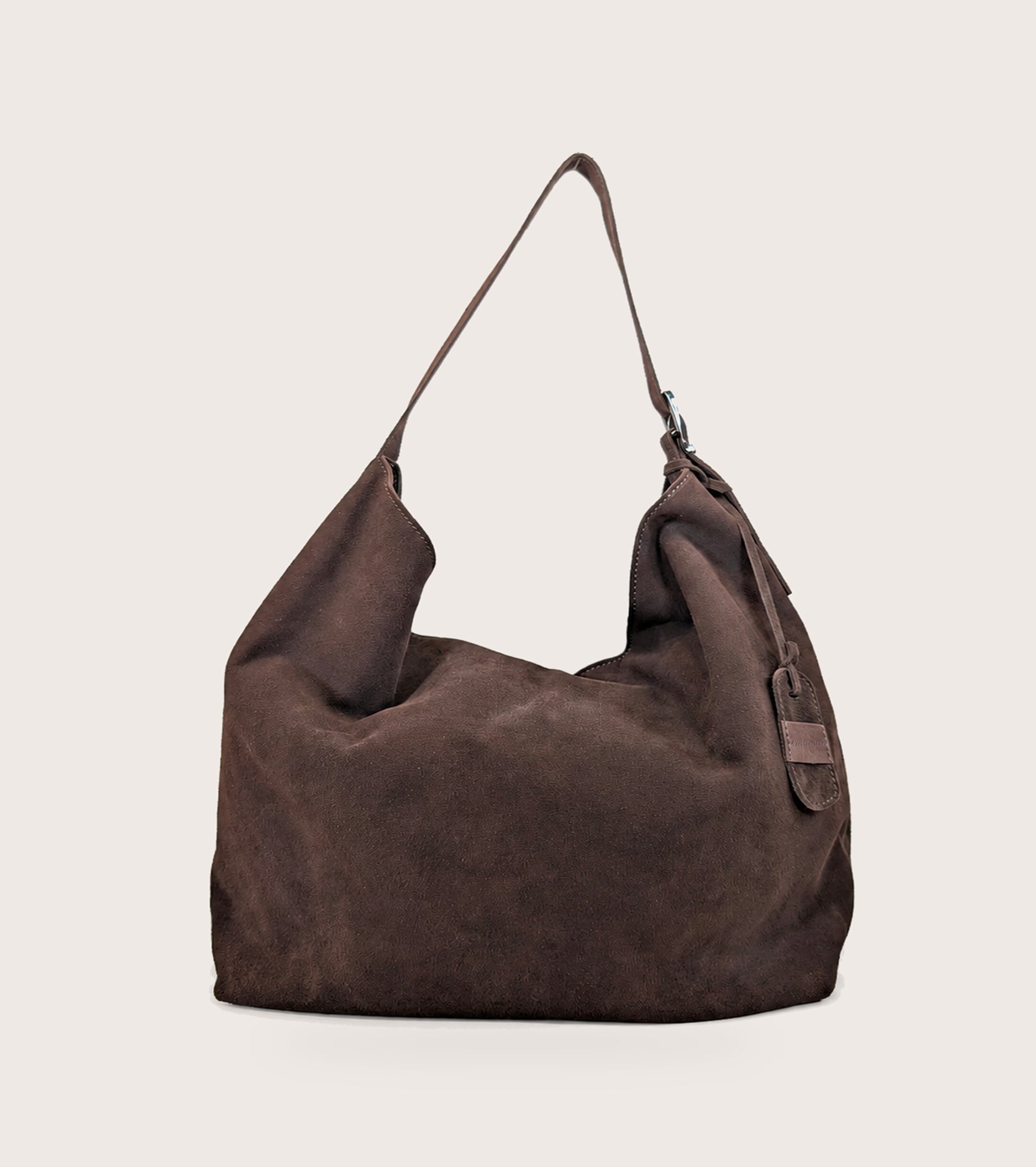 Suede shoulder bag with ebony charm