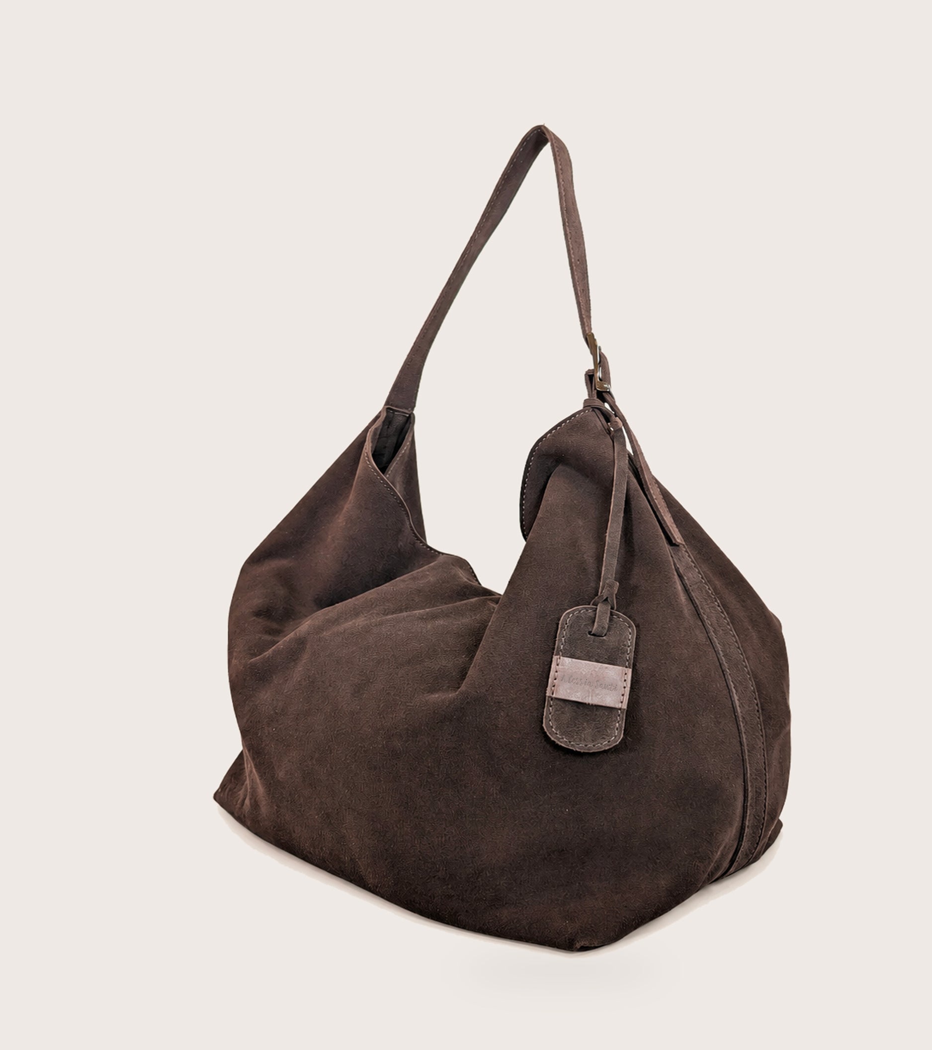 Suede shoulder bag with ebony charm