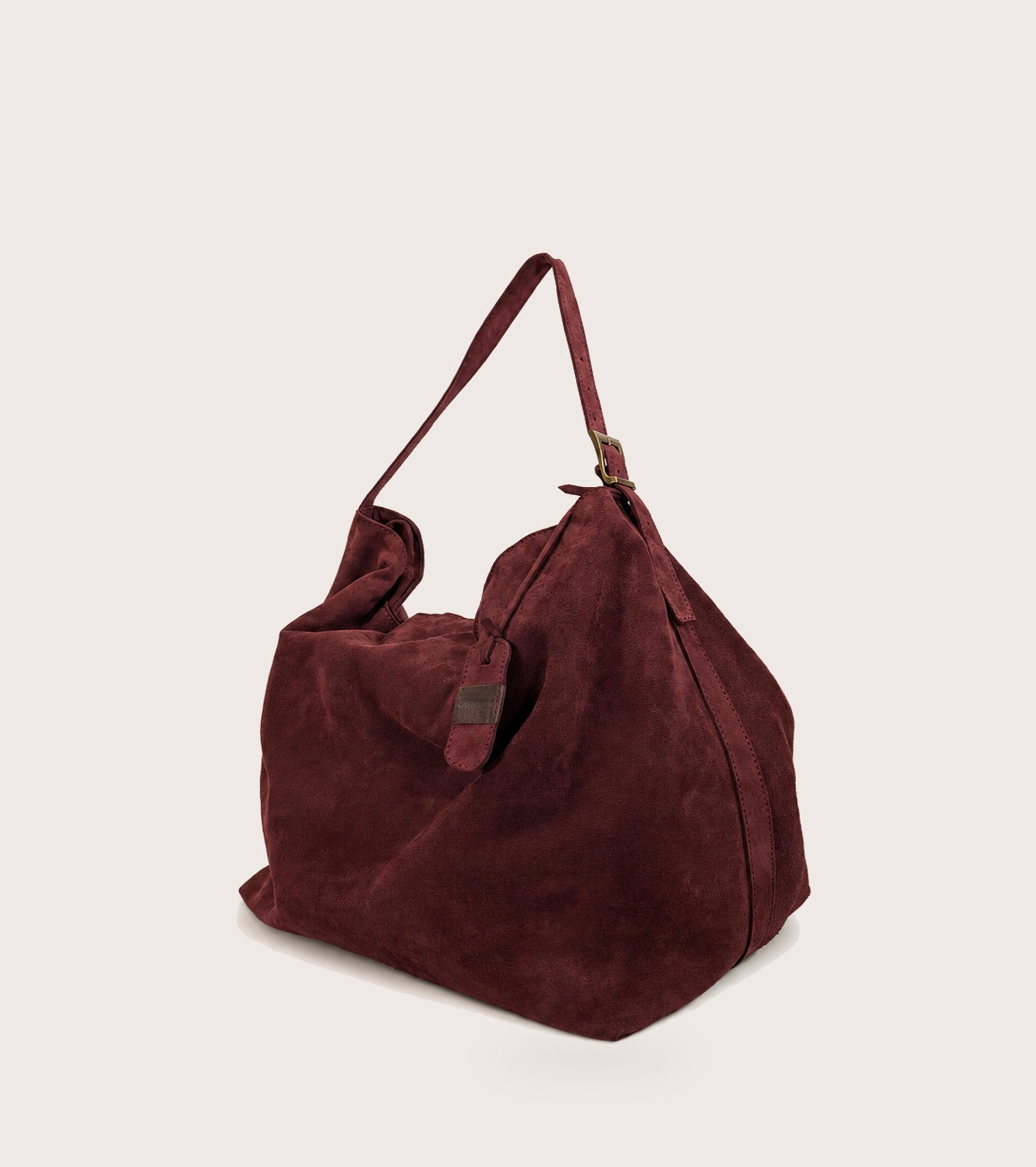 Borsa a spalla in suede con charm mosto